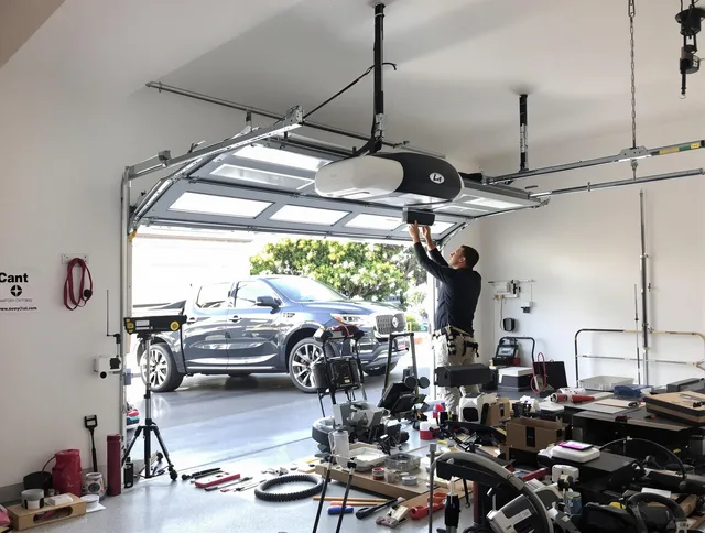 Willowick Garage Door Repair specialist installing smart garage door opener system in Willowick home