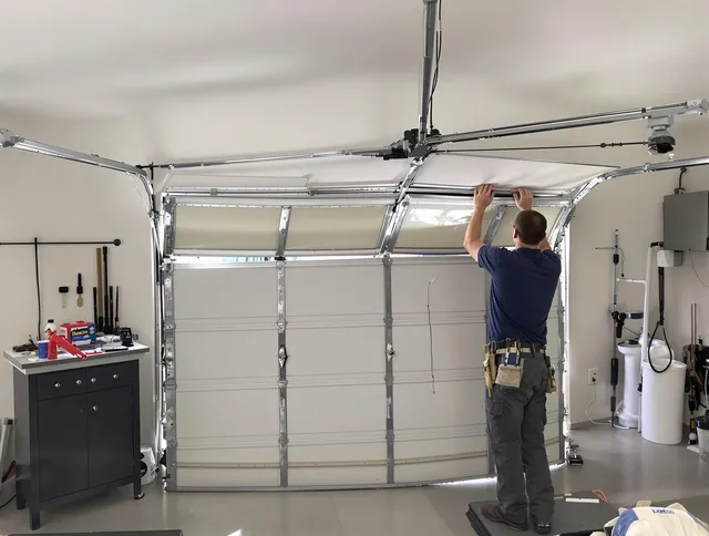 Willowick Garage Door Repair specialist performing precise section replacement on Willowick garage door